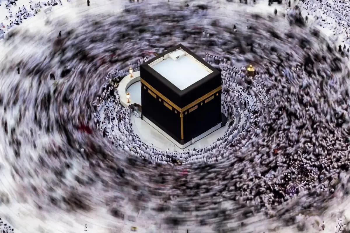 The Kaaba seen from above, with the pilgrims circling it blurred by a long exposure